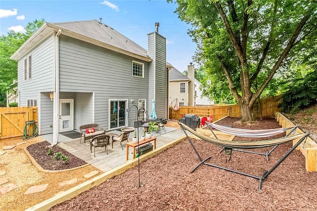 2865 Winter Rose Ct, Dunwoody, GA 30360 - rear view of house featuring a patio, a fenced backyard, and outdoor lounge area
