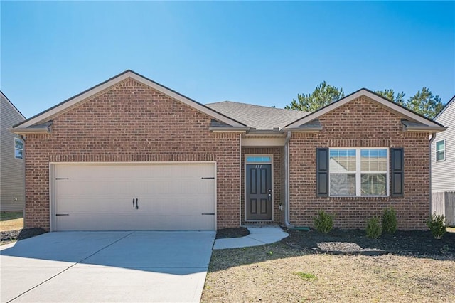 ranch-style home with a garage, brick siding, driveway, and a shingled roof