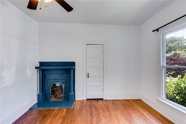 1405 May Ave SE, Atlanta, GA 30316 - unfurnished living room with plenty of natural light, ceiling fan, hardwood / wood-style floors, and a fireplace with raised hearth
