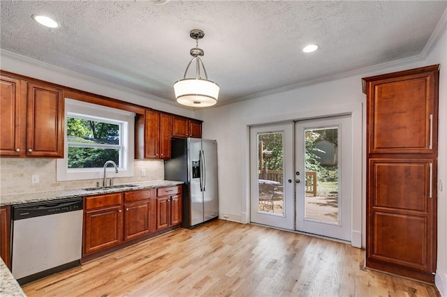1405 May Ave SE, Atlanta, GA 30316 - kitchen featuring a sink, appliances with stainless steel finishes, a textured ceiling, ornamental molding, and french doors