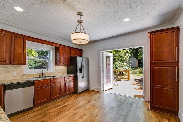 1405 May Ave SE, Atlanta, GA 30316 - kitchen featuring a sink, stainless steel appliances, a textured ceiling, plenty of natural light, and backsplash