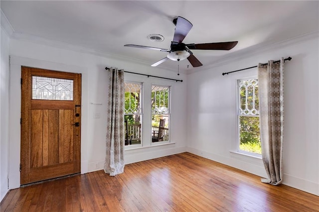 1405 May Ave SE, Atlanta, GA 30316 - foyer with healthy amount of natural light, wood-type flooring, ornamental molding, and baseboards