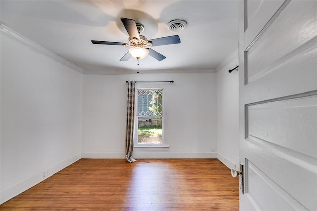 1405 May Ave SE, Atlanta, GA 30316 - empty room with crown molding, wood finished floors, a ceiling fan, and baseboards