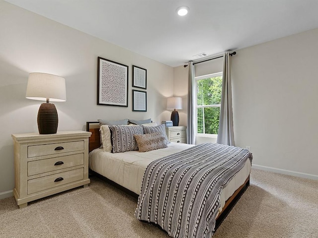 bedroom with light carpet