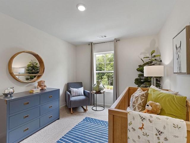 bedroom featuring light carpet