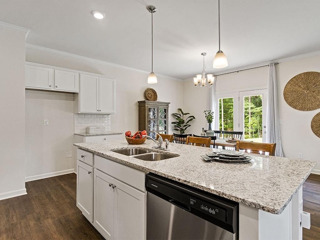 kitchen with a center island with sink, dishwasher, white cabinetry, and sink