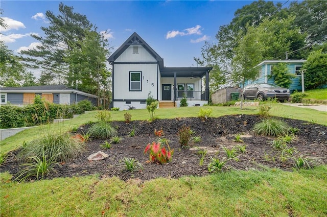 115 Dahlia Ave NW, Atlanta, GA 30314 - view of front of home featuring crawl space, covered porch, and a front lawn