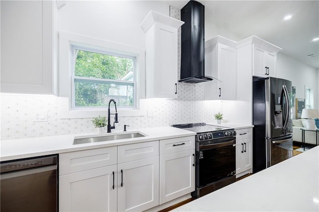 115 Dahlia Ave NW, Atlanta, GA 30314 - kitchen with appliances with stainless steel finishes, wall chimney exhaust hood, light countertops, white cabinetry, and tasteful backsplash
