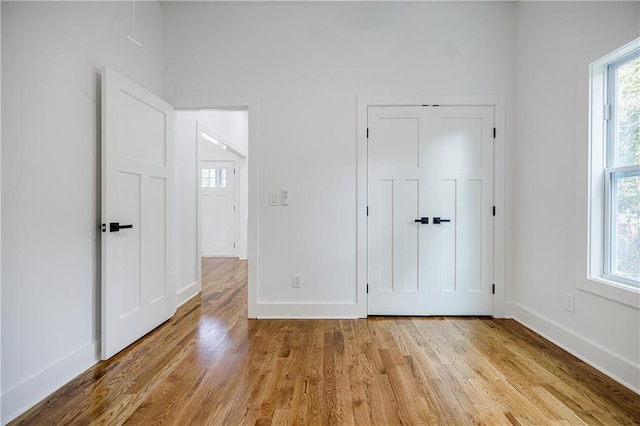 115 Dahlia Ave NW, Atlanta, GA 30314 - unfurnished bedroom with baseboards and wood finished floors