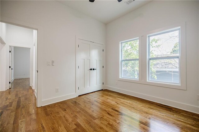 115 Dahlia Ave NW, Atlanta, GA 30314 - unfurnished bedroom featuring baseboards and wood finished floors