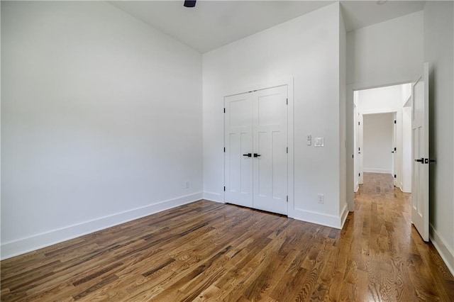 115 Dahlia Ave NW, Atlanta, GA 30314 - unfurnished bedroom featuring wood finished floors, a closet, and a ceiling fan