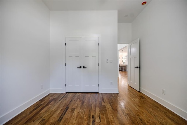 115 Dahlia Ave NW, Atlanta, GA 30314 - unfurnished bedroom with dark wood-style flooring and a closet