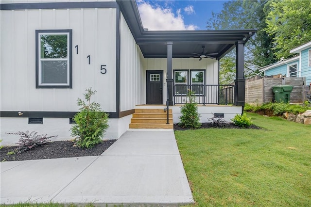 115 Dahlia Ave NW, Atlanta, GA 30314 - property entrance with covered porch, ceiling fan, board and batten siding, and crawl space
