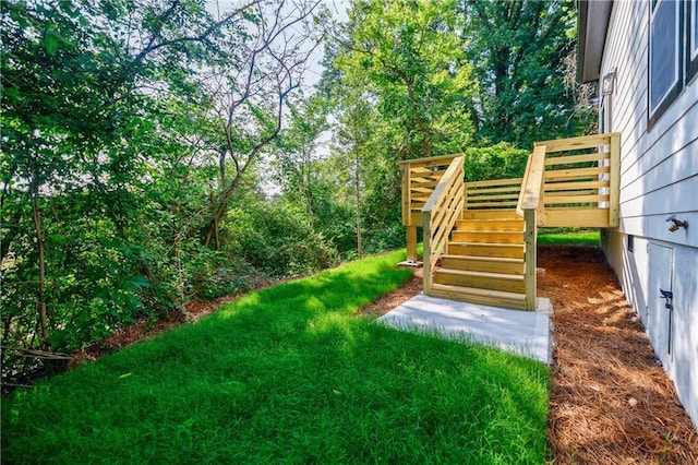 115 Dahlia Ave NW, Atlanta, GA 30314 - view of grassy yard with stairs and a deck