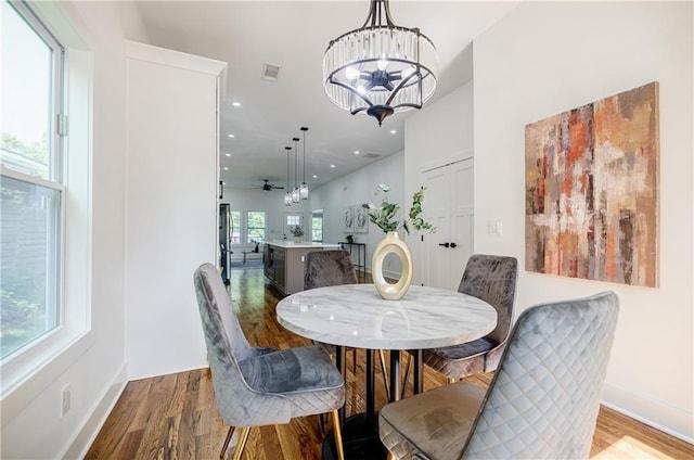 115 Dahlia Ave NW, Atlanta, GA 30314 - dining area with wood finished floors, a chandelier, and recessed lighting