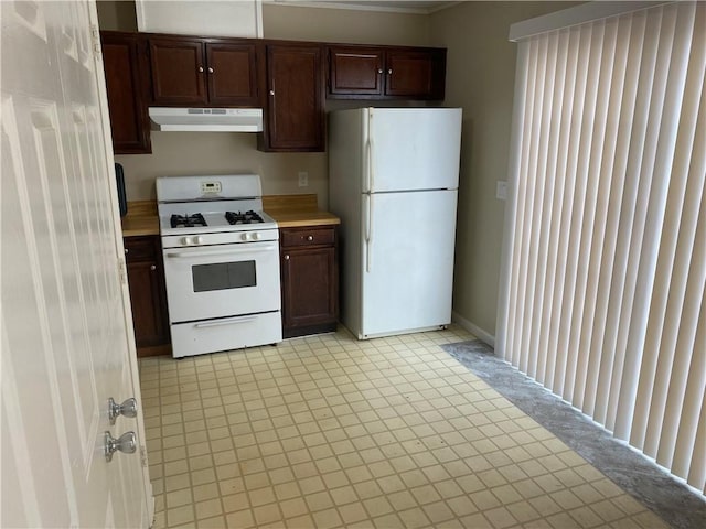 6448 Charter Way, Lithonia, GA 30058 - kitchen with white appliances, under cabinet range hood, light countertops, dark brown cabinets, and light floors