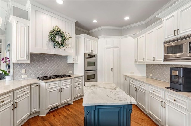 5173 Brendlynn Dr, Suwanee, GA 30024 - kitchen with appliances with stainless steel finishes, white cabinets, decorative backsplash, recessed lighting, and ornamental molding