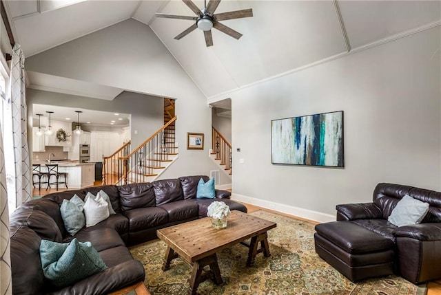 5173 Brendlynn Dr, Suwanee, GA 30024 - living area with a ceiling fan, stairs, and high vaulted ceiling