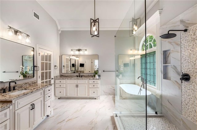 5173 Brendlynn Dr, Suwanee, GA 30024 - bathroom with a marble finish shower, a freestanding bath, two vanities, crown molding, and a towering ceiling