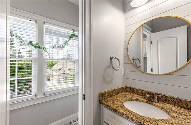 5173 Brendlynn Dr, Suwanee, GA 30024 - bathroom with plenty of natural light, vanity, and baseboards