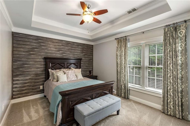 5173 Brendlynn Dr, Suwanee, GA 30024 - bedroom featuring a tray ceiling, baseboards, carpet floors, an accent wall, and crown molding