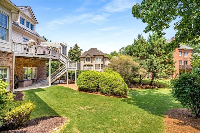 5173 Brendlynn Dr, Suwanee, GA 30024 - view of green lawn featuring a wooden deck, stairway, and a patio
