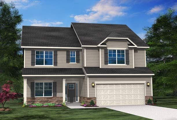 view of front of home featuring a front yard and a garage