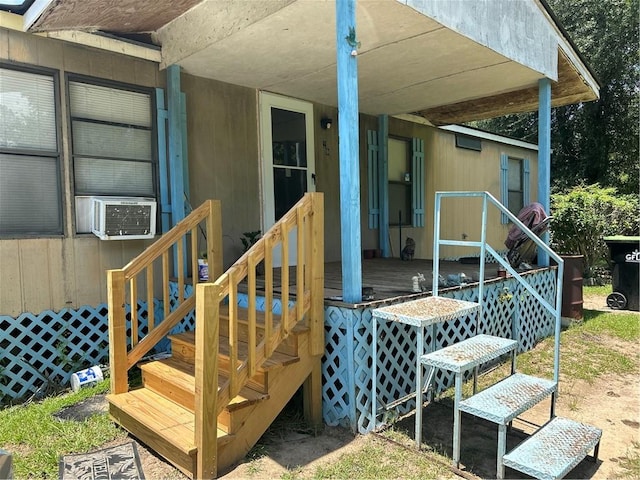 wooden terrace featuring cooling unit