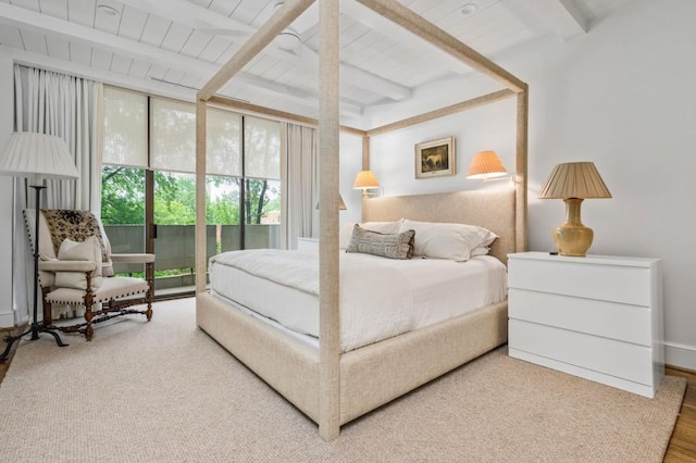 2575 Peachtree Rd NE Unit 8D, Atlanta, GA 30305 - bedroom with wood finished floors and wooden ceiling with exposed beams