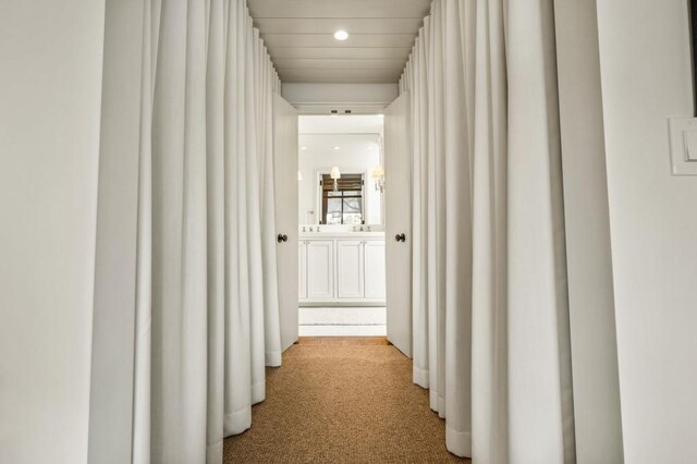 corridor with carpet flooring and recessed lighting