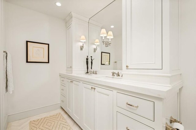2575 Peachtree Rd NE Unit 8D, Atlanta, GA 30305 - bathroom featuring double vanity, recessed lighting, and baseboards