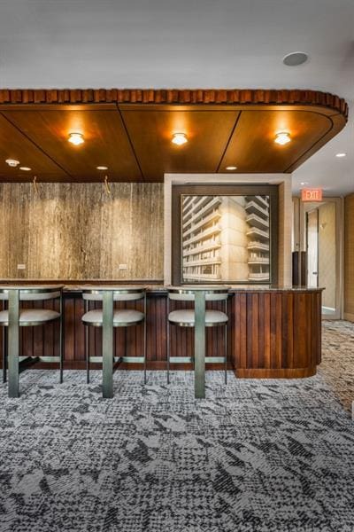 2575 Peachtree Rd NE Unit 8D, Atlanta, GA 30305 - bar featuring carpet and wood walls