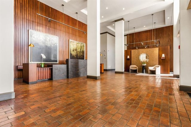 2575 Peachtree Rd NE Unit 8D, Atlanta, GA 30305 - reception with a high ceiling, recessed lighting, and wood walls