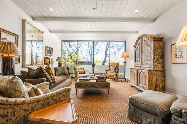 interior space with baseboards, carpet floors, beamed ceiling, and recessed lighting