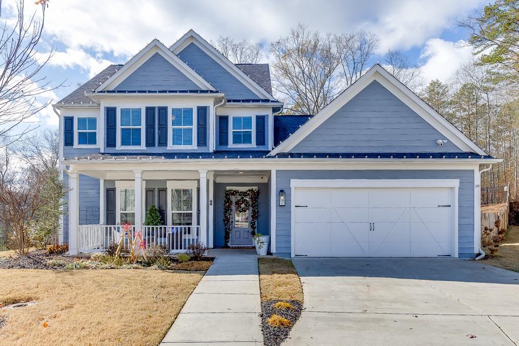 craftsman house with covered porch and a garage