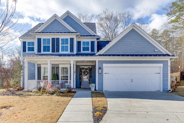 craftsman house with covered porch and a garage