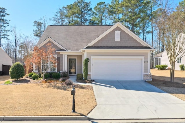 craftsman inspired home featuring driveway, brick siding, and an attached garage