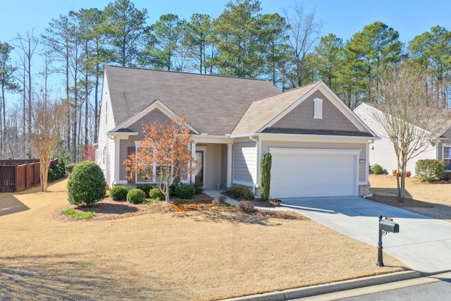 view of front of home with concrete driveway and an attached garage