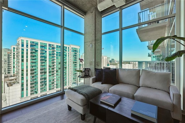 sunroom / solarium featuring a view of city