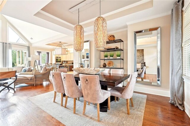 living room featuring a fireplace, a chandelier, high vaulted ceiling, and french doors