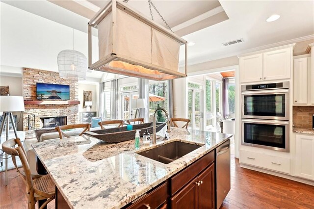 sunroom featuring wood ceiling, vaulted ceiling, and ceiling fan