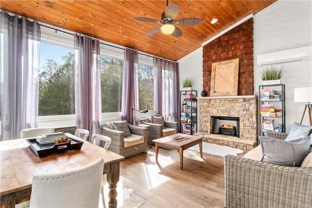 interior space featuring french doors, wooden walls, a stone fireplace, and crown molding