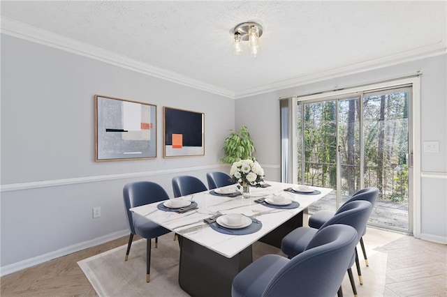 dining space with baseboards, a textured ceiling, and crown molding