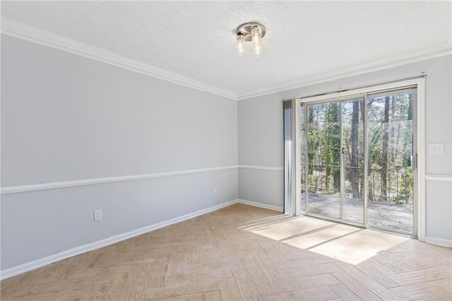 unfurnished room with baseboards, a textured ceiling, and crown molding