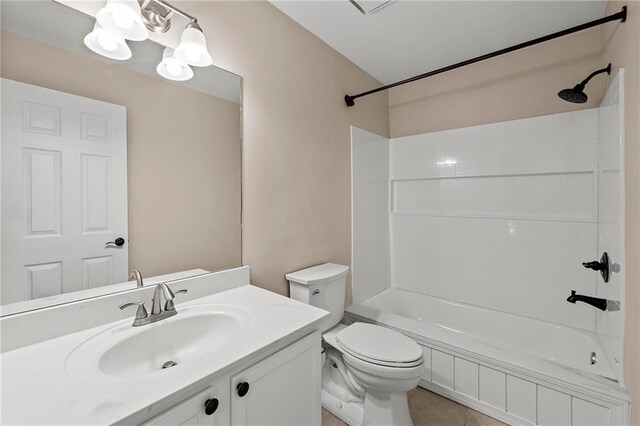 full bathroom featuring toilet, vanity, tile patterned floors, and shower / bathtub combination