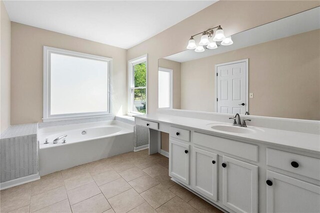 bathroom featuring a washtub, vanity, and tile patterned floors