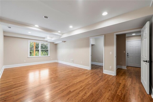 basement featuring hardwood / wood-style floors