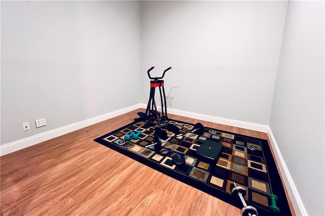 workout room featuring hardwood / wood-style floors