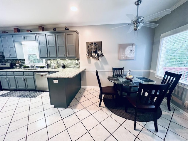 interior space with light tile patterned floors, sink, and ceiling fan