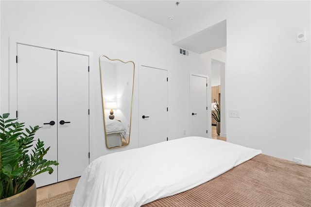 567 Ponce De Leon Ave NE Unit 614, Atlanta, GA 30308 - bedroom with two closets and light wood-type flooring